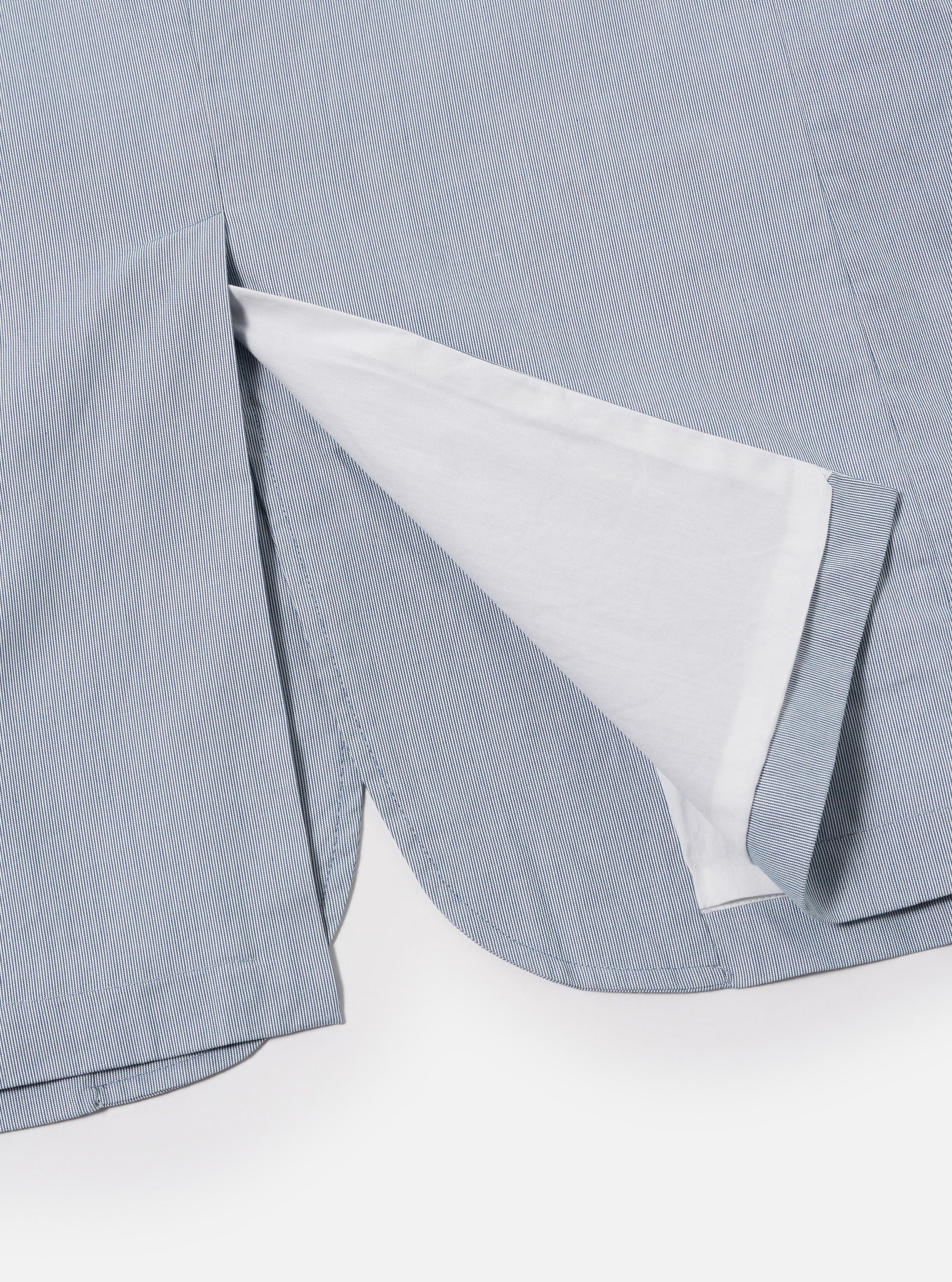 The Navy Kennedy Stripe Boston Blazer is shown as a flat lay against a white background. The blazer features a classic notched lapel, a three-button front closure, and two large patch pockets at the waist with a single patch pocket at the chest. The fabric is navy blue with a prominent white vertical pinstripe throughout.