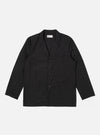 The Black Recycled Polytech Capitol Jacket is shown as a flat lay against a white background. The jacket features a notch lapel, a button-down front, and four front pockets with flaps. The black fabric is a recycled polyester and cotton blend with a smooth, technical finish.
