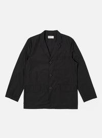 The Black Recycled Polytech Capitol Jacket is shown as a flat lay against a white background. The jacket features a notch lapel, a button-down front, and four front pockets with flaps. The black fabric is a recycled polyester and cotton blend with a smooth, technical finish.
