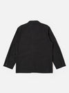 The Black Recycled Polytech Capitol Jacket is shown from the back as a flat lay against a plain white background. The image highlights the smooth black fabric, a single rear vent at the hem, and the clean construction of the shoulders and sleeves.