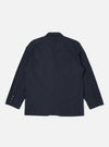 The Navy Recycled Polytech Capitol Jacket is shown from the back as a flat lay against a plain white background. The jacket features a clean, structured back with a visible seam running vertically down the center and a small rectangular patch detail near the neck. The hem and cuffs are simple and finished.