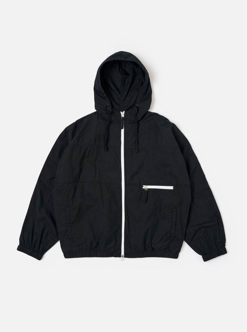 The Navy Cotton Recycled Nylon Mix Daley Jacket is shown as a flat lay against a white background. The jacket features a full-zip front, a drawstring hood, and two large slanted front pockets. The fabric has a smooth, matte finish.