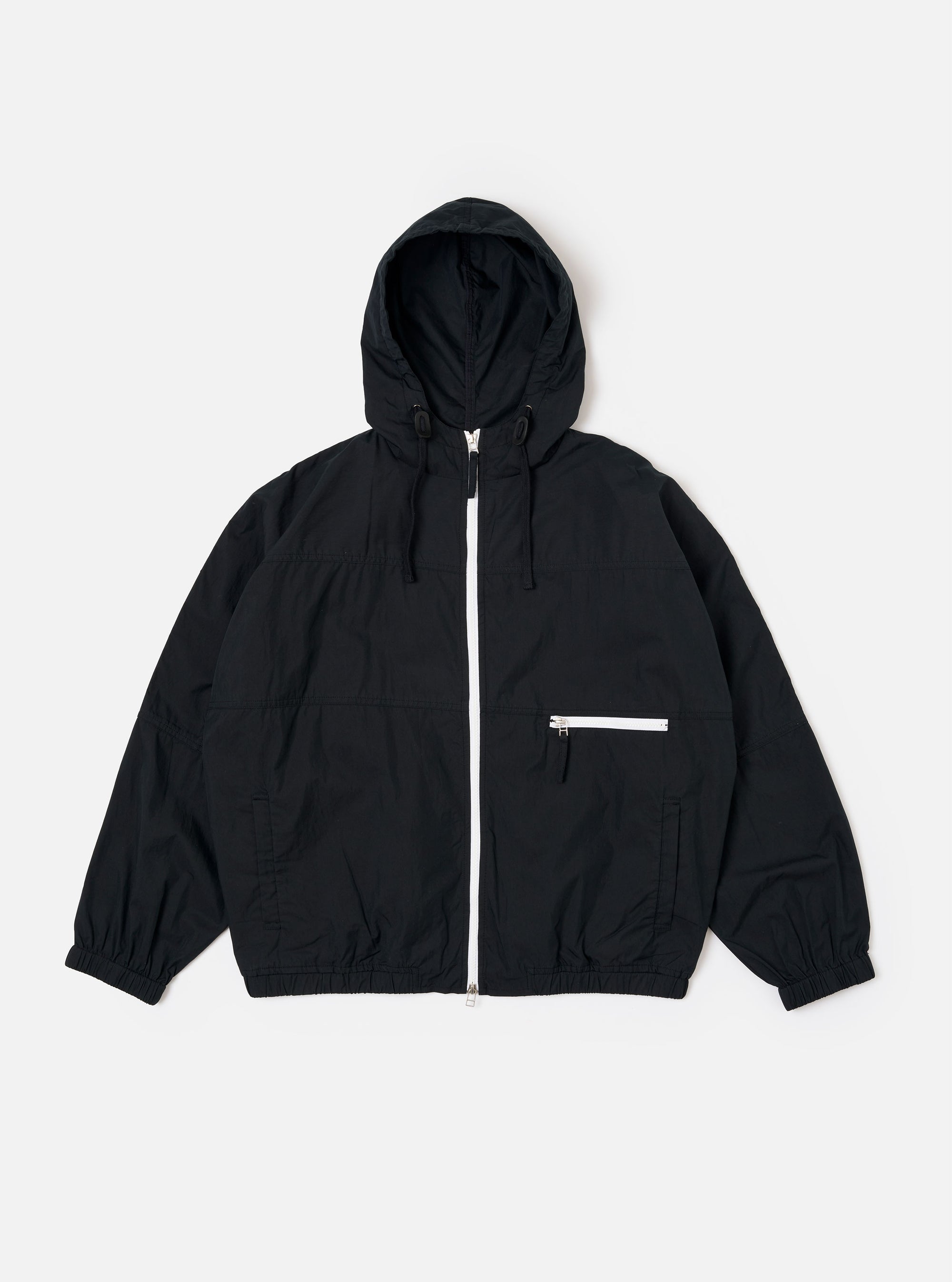The Navy Cotton Recycled Nylon Mix Daley Jacket is shown as a flat lay against a white background. The jacket features a full-zip front, a drawstring hood, and two large slanted front pockets. The fabric has a smooth, matte finish.