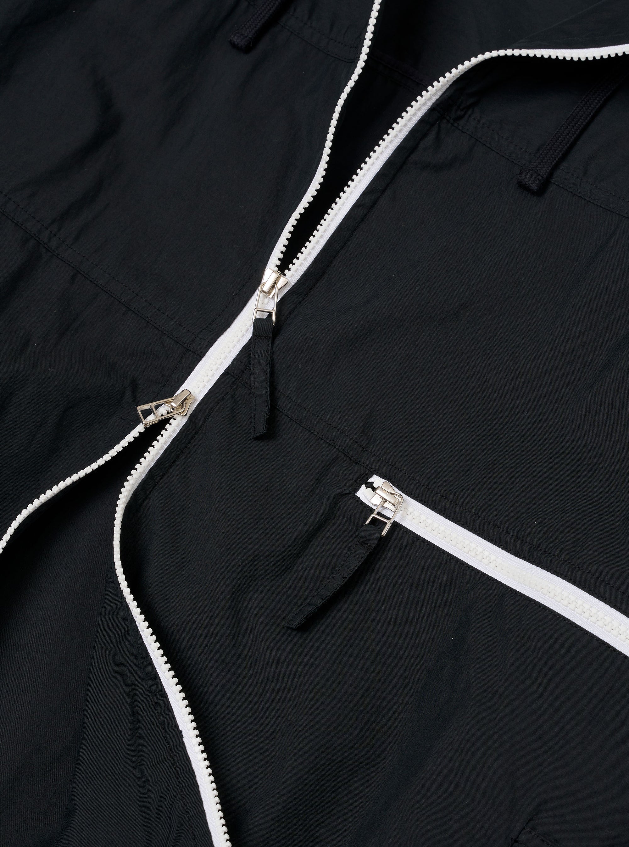 The Navy Cotton Recycled Nylon Mix Daley Jacket is shown from the back as a flat lay against a white background. The image highlights the oversized, blouson fit, the large sleeves, and a prominent horizontal panel detail across the upper back.
