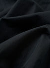 The Navy Cotton Recycled Nylon Mix Daley Jacket is shown in a detail view as a flat lay against a white background. This close-up highlights the adjustable drawstring hood, the top of the zipper closure, and the crisp texture of the navy blue cotton-nylon blend fabric.