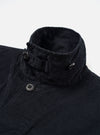 The Black Organic Fine Cord Duty Jacket is shown from the back as a flat lay against a white background. The image highlights the center back seam, the straight hem, and the fine-waled texture of the black corduroy fabric.