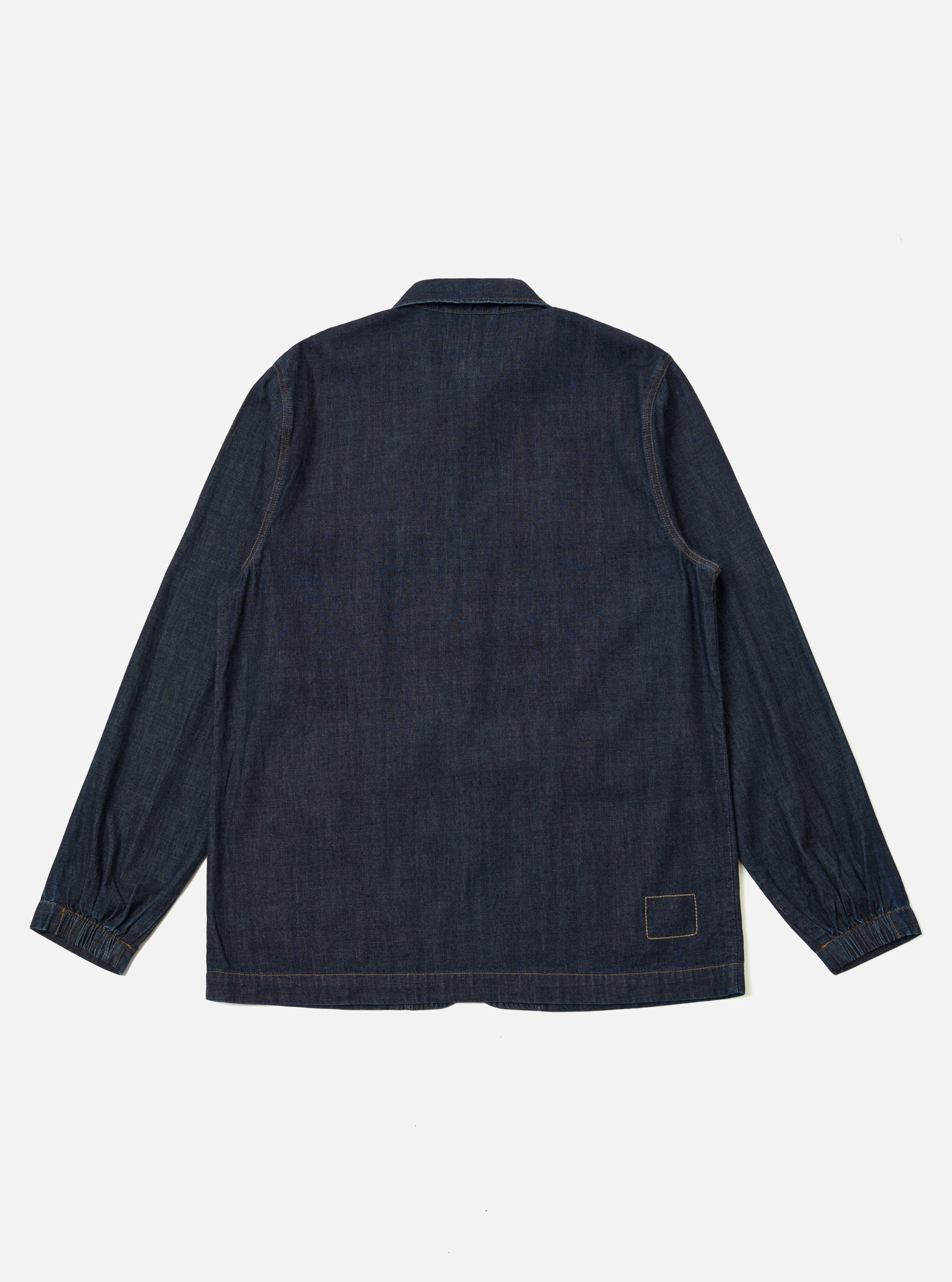 The Indigo Kaihara LT WT Denim Labour Jacket is shown from the back as a flat lay against a plain white background. The image highlights the clean construction of the rear panel, the classic collar, and the deep indigo blue color of the lightweight denim.