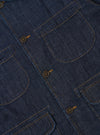 The Indigo Kaihara LT WT Denim Labour Jacket is shown from the back as a flat lay against a plain white background. The image highlights the clean construction of the garment's rear panel, featuring a straight hem and a simple one-piece back. The indigo-dyed denim fabric has a smooth, lightweight appearance with visible stitching details.