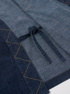 The Indigo Kaihara LT WT Denim Kyoto Work Jacket is shown from a rear angle as a flat lay against a plain white background. The jacket features a straight hem and a loose, unstructured fit. The deep indigo denim fabric has a visible texture.
