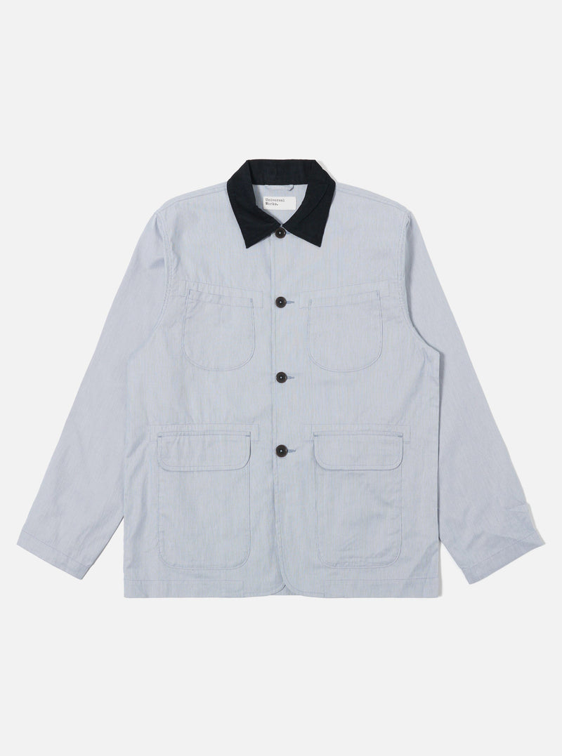 The Navy Kennedy Stripe Labour Jacket is shown as a flat lay against a plain white background. The jacket features a classic chore coat silhouette with a four-button front closure, a structured collar, and three large patch pockets on the front. The organic cotton fabric has a distinct vertical white stripe pattern on a dark navy base.
