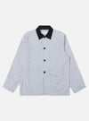The Navy Kennedy Stripe Labour Jacket is shown as a flat lay against a plain white background. The jacket features a classic chore coat silhouette with a four-button front closure, a structured collar, and three large patch pockets on the front. The organic cotton fabric has a distinct vertical white stripe pattern on a dark navy base.