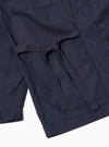 The Navy Peached Poplin Osaka Work Jacket is shown from the back as a flat lay against a plain white background. The image highlights the clean construction of the garment's rear, the wrap-style collar, and the smooth texture of the navy blue peached poplin fabric.
