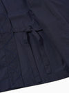 The Navy Peached Poplin Osaka Work Jacket is shown from the back as a flat lay against a plain white background. The image highlights the clean lines of the jacket's rear panel, the simple wrap-style collar, and the smooth, matte texture of the navy blue cotton poplin.