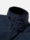 The Navy Recycled Polytech Parachute Field Jacket is shown from the back in a detail shot against a plain white background. The image highlights the adjustable drawcord hem with a toggle and the smooth, technical texture of the navy recycled polytech fabric.
