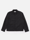 The Black Recycled Polytech Rose Bowl Jacket is shown as a flat lay against a white background. The jacket features a boxy silhouette, a zip-front closure, and an oversized collar. It has one large patch pocket on the chest and two welt pockets at the waist. The fabric is a smooth, black recycled polytech material.