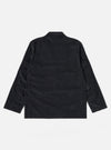 The Black Organic Fine Cord Two Button Jacket is displayed from the back as a flat lay against a plain white background. The image highlights the clean lines of the garment, featuring a central vent at the hem and a structured two-piece sleeve construction. The fine-ribbed texture of the black organic cotton corduroy is visible across the entire surface.