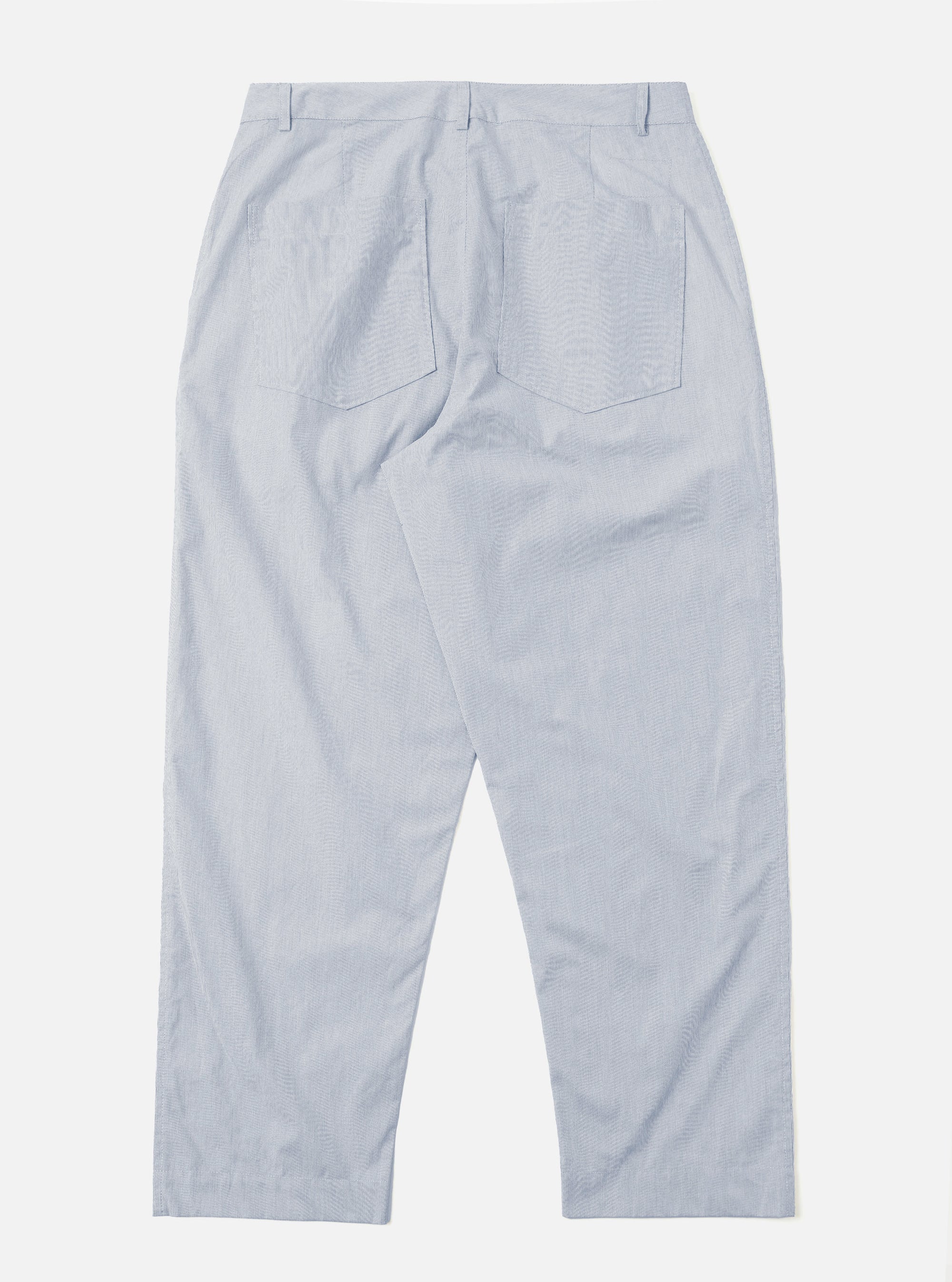 The Navy Kennedy Stripe Duke Pant is shown from the back as a flat lay against a plain white background. The trousers feature a navy blue cotton fabric with thin white vertical stripes, two rear welt pockets with button closures, and a wide-leg silhouette.
