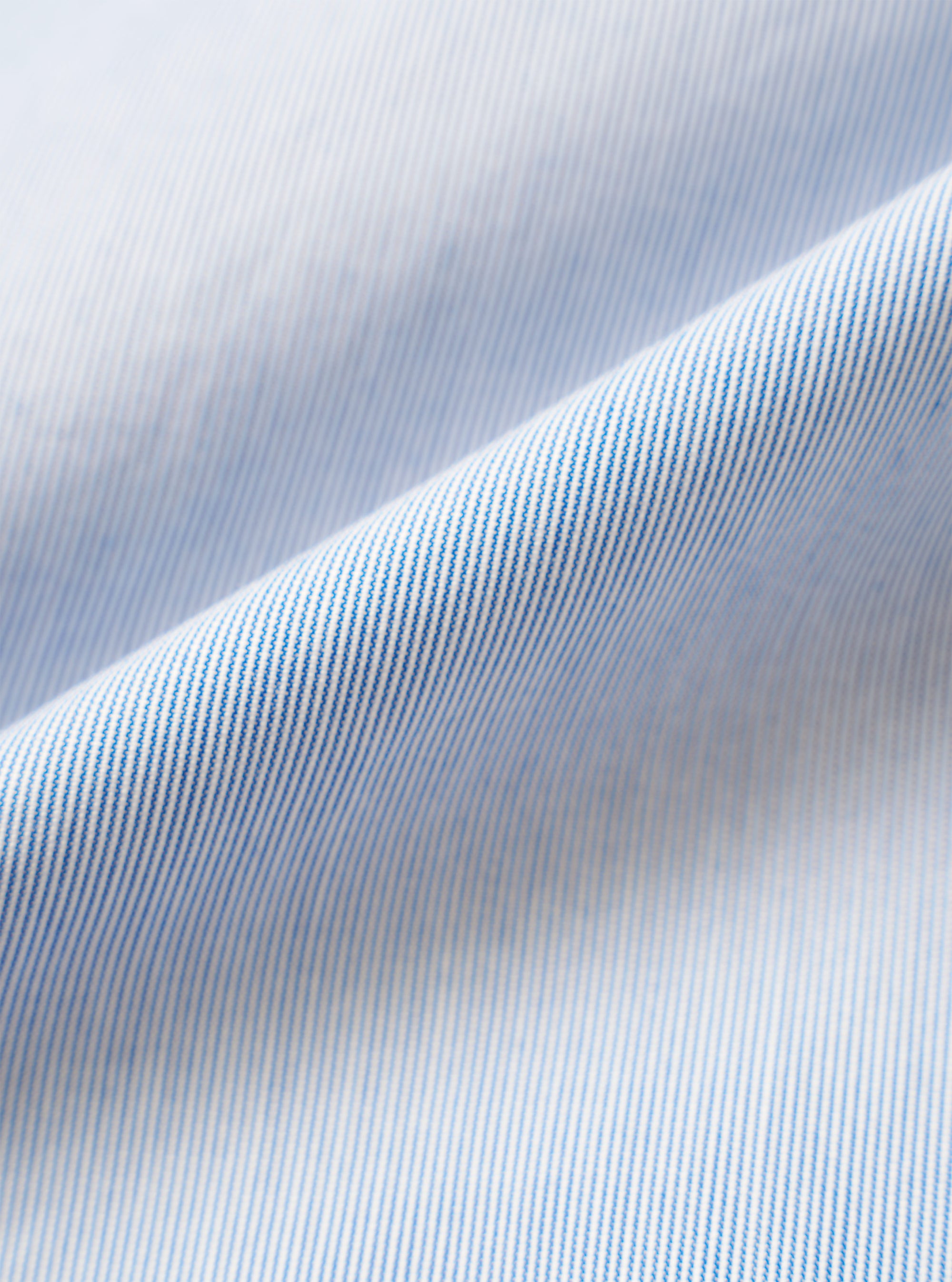 A close-up fabric swatch of the Navy Kennedy Stripe Duke Pant displays the navy blue color and the distinct vertical stripe pattern. The image focuses on the texture of the cotton fabric, which fills the entire frame.