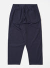 The Navy Peached Poplin Dutch Pant is shown from the back as a flat lay against a white background. The image highlights the loose, wide-leg fit and features two large rear patch pockets with button closures and a visible brand label above the right pocket.