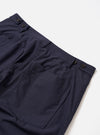 The Navy Peached Poplin Dutch Pant is shown from the back as a flat lay against a plain white background. The trousers feature a wide-leg silhouette and two large rear patch pockets. The peached poplin fabric appears smooth with a soft, matte finish.