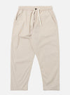 The Brown Kennedy Stripe Hi Water Trouser is shown as a flat lay against a white background. The trousers feature a vertical striped pattern in brown and tan tones. They are designed with an elasticated waistband, a visible drawstring, and a slim, cropped leg.