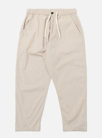 The Brown Kennedy Stripe Hi Water Trouser is shown as a flat lay against a white background. The trousers feature a vertical striped pattern in brown and tan tones. They are designed with an elasticated waistband, a visible drawstring, and a slim, cropped leg.