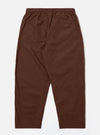 The Brown Peached Poplin Judo Pant is shown from the rear as a flat lay against a plain white background. The image highlights the elasticated waistband and the two large rear patch pockets. The smooth texture of the brown cotton poplin fabric is visible.