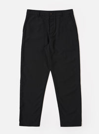 The Black Tropical Suiting Military Chino is shown as a flat lay against a white background. The trousers feature a slim, straight-leg fit, a mid-rise waist with a button fly, and two slanted front pockets. The fabric is a smooth, black tropical suiting material.