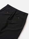 The Black Tropical Suiting Military Chino is shown from a rear angle as a flat lay against a plain white background. The image highlights the two rear jetted buttoned pockets and the clean, tapered cut of the black tropical suiting fabric through the legs to the hem.