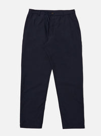 The Navy Tropical Suiting Military Chino is shown as a flat lay against a plain white background. The trousers feature a mid-rise, a button fly, and two front slanted pockets. The fabric is a smooth navy blue tropical suiting made from a wool and polyester blend.
