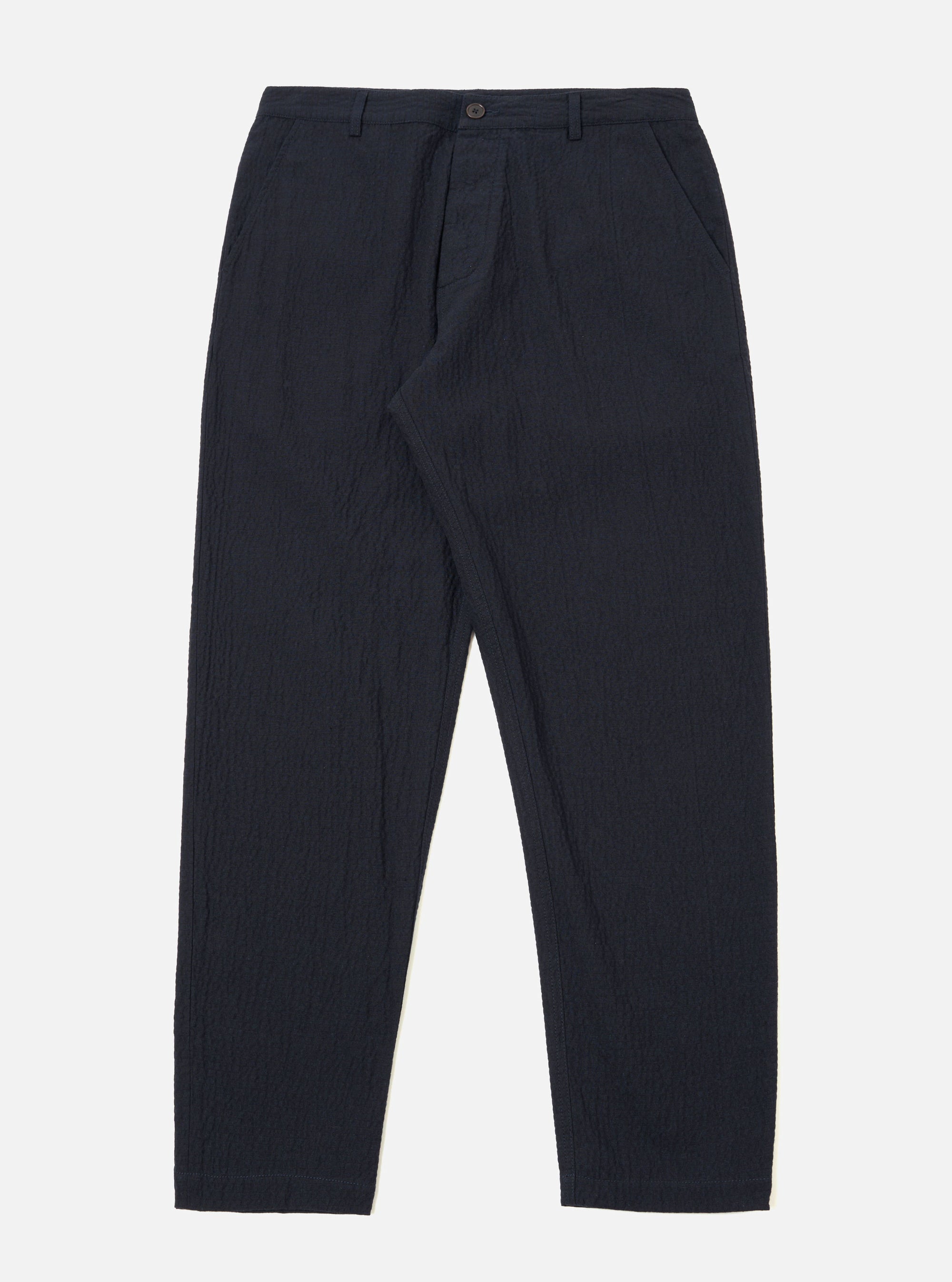 The Dark Navy Ospina Cotton Military Chino is shown as a flat lay against a white background. The trousers feature a regular, tapered leg, a button fly fastening, and two front slanted pockets. The dark navy fabric has a visible puckered seersucker texture.