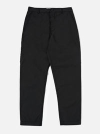 The Black Recycled Polytech Military Chino is shown as a flat lay against a plain white background. The trousers feature a button fly, belt loops, and a tapered leg design. Two front slash pockets and a small coin pocket are visible near the waistband. The black fabric has a smooth, technical finish.