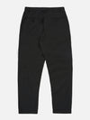 The Black Recycled Polytech Military Chino is shown from the back as a flat lay against a plain white background. The image highlights the two rear jetted buttoned pockets and the straight-cut design of the legs. The black recycled polytech fabric has a smooth, matte finish.