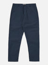The Navy Recycled Polytech Military Chino is shown as a flat lay against a plain white background. The trousers feature a button closure at the waist, a central zip fly, and two slanted front pockets. The dark navy fabric has a smooth, technical finish, and the garment is cut with a slight taper toward the hem.