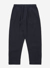 The Dark Navy Ospina Cotton Oxford Pant is shown as a flat lay against a white background. The trousers feature a single pleat at the front, a button fly, and an elasticated waistband with an external drawstring. The dark navy fabric has a visible puckered seersucker texture throughout.