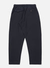 The Dark Navy Ospina Cotton Oxford Pant is shown from the back as a flat lay against a plain white background. The image highlights the elasticated waistband with a drawstring and two rear pockets: one with a buttoned flap and one with a buttoned jet. The dark navy fabric features a visible puckered seersucker texture.