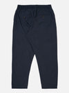 The Navy Recycled Polytech Pleated Track Pant is shown from the back as a flat lay against a plain white background. The image highlights the elasticated waistband and the two rear pockets, featuring one button-down flap pocket and one jetted pocket. The dark navy fabric appears smooth with a technical, utilitarian finish.
