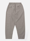 The Grey Brown Wales Glen Check Pleated Track Pant is shown from the back as a flat lay against a plain white background. The image highlights the elasticated waistband and a single rear patch pocket with a buttoned flap. The cotton fabric features a detailed grey and brown glen check pattern and a tapered leg silhouette.