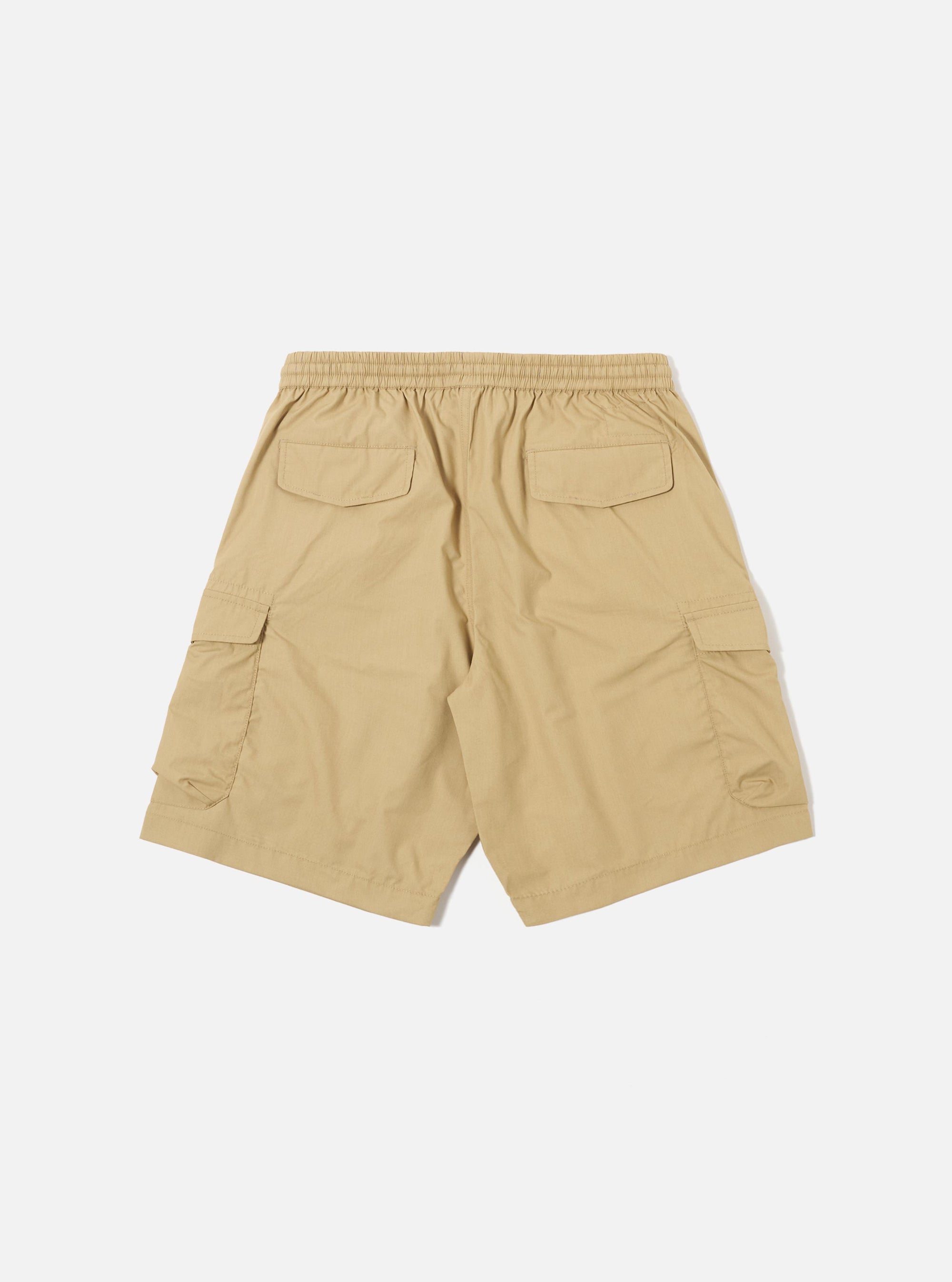 The Sand Recycled Polytech Parachute Short is shown from the back as a flat lay against a plain white background. The image highlights the two rear patch pockets with button closures and the elasticated waistband.