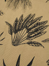 The Sand Jungle Toile Twill 4 Pocket Gilet is shown as a square fabric swatch, providing a close-up view of the detailed jungle toile pattern. The design features various animals and tropical foliage printed in a dark shade against a light sand-colored background.