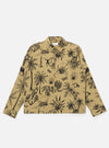 The Sand Jungle Toile Twill Windcheater Jacket is shown as a flat lay against a plain white background. The jacket features an all-over jungle toile print with dark illustrations of foliage and animals on a sand-colored base. It has a classic pointed collar, a central zip front, two slanted side pockets, and elasticated cuffs and hem.
