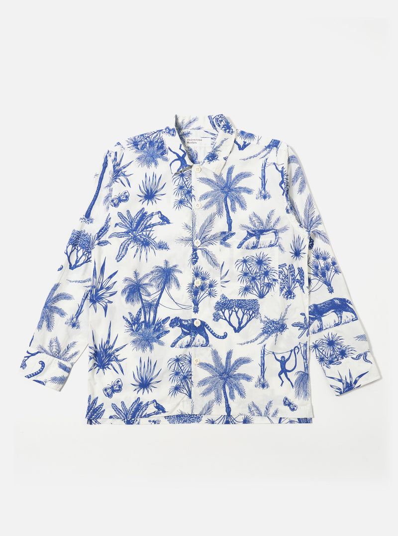 The White Jungle Toile Poplin Fatigue Shirt is shown as a flat lay against a white background. The shirt features an all-over dark jungle toile print with animal and botanical motifs on a white base. It has a one-piece collar, a single large square patch pocket on the chest, and a five-button front closure with oversized buttons.