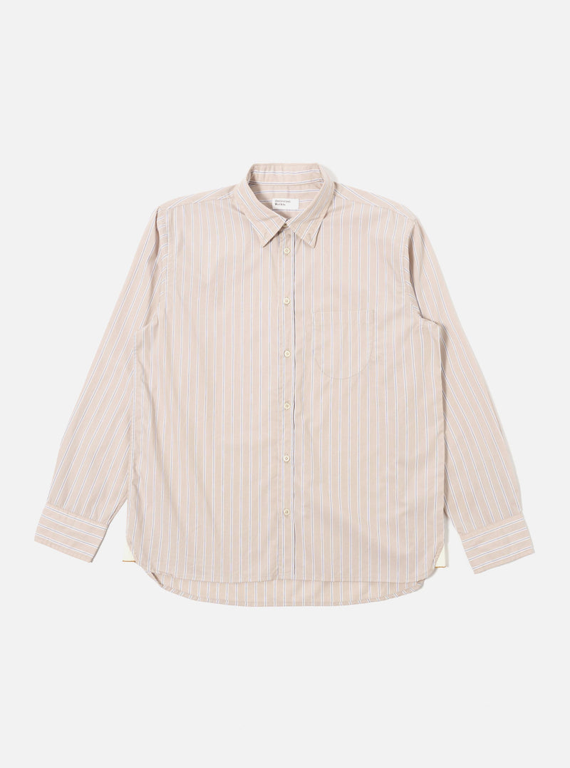 The Sand Urban Stripe Lazy Day Shirt is presented as a flat lay against a plain white background. The long-sleeved shirt features a vertical striped pattern in sand and white, a button-down collar, and a visible asymmetrical chest pocket on the left side. The hem is slightly curved, and the full button placket is centered.