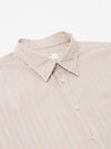 The Sand Urban Stripe Lazy Day Shirt is shown from the back as a flat lay against a plain white background. This view highlights the shirt's back yoke and a central box pleat, emphasizing its relaxed fit. The cotton fabric features a vertical stripe pattern in sand and stone colors.