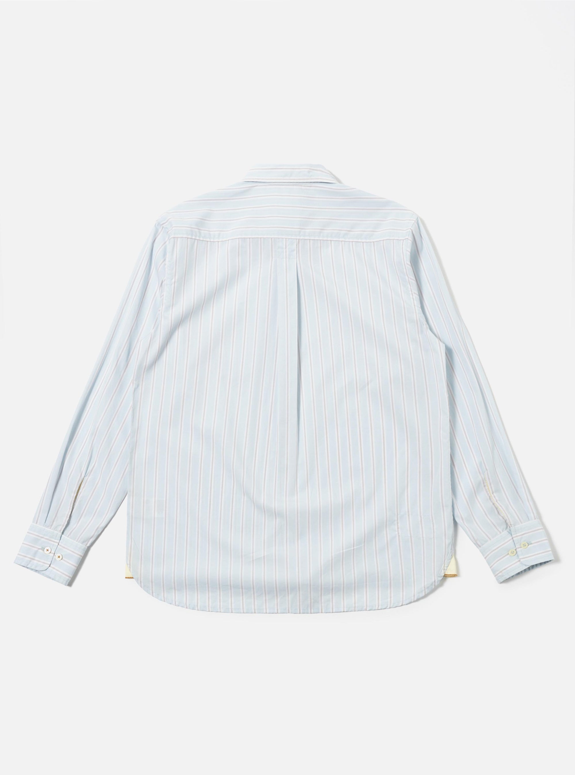 The Sky Urban Stripe Lazy Day Shirt is shown from the back as a flat lay against a plain white background. The shirt features a light blue and white vertical stripe pattern, a simple back yoke, and a relaxed, straight-cut hem.