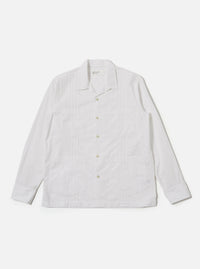 The White Poplin Dwight Overshirt is shown as a flat lay against a plain white background. The overshirt features a relaxed camp collar, a full button-front closure, and two large utility-style patch pockets on the chest. The fabric is a crisp white cotton poplin.