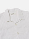 The White Poplin Dwight Overshirt is shown from the back as a flat lay against a plain white background. The image highlights the clean construction of the shoulders and the straight hem of the garment. The white poplin fabric appears smooth and lightweight.