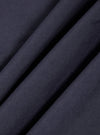 A close-up fabric swatch of the Navy Poplin Patched Lazy Day Shirt displays a deep navy blue color and a smooth, tightly woven cotton poplin texture.