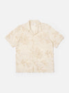 The Ecru 3D Flower Road Shirt is shown as a flat lay against a white background. The short-sleeve shirt features a single-piece loop-close collar, a straight hem, and a single chest patch pocket on the left side. The fabric is decorated with a tonal 3D flower pattern.