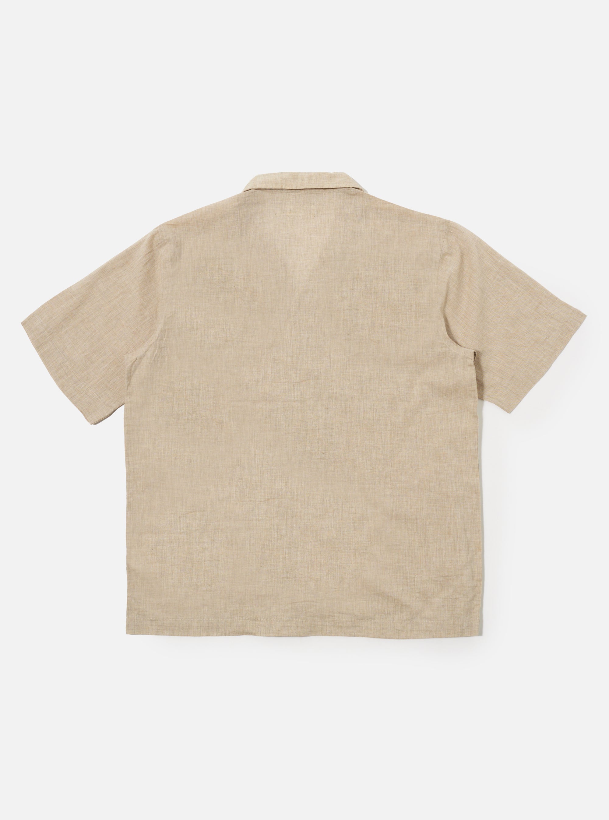 The Beige Fine Organic Cotton Sal Road Shirt is shown from the back as a flat lay against a plain white background. The image highlights the shirt's straight hem, short sleeves, and the soft marled texture of the beige organic cotton fabric.